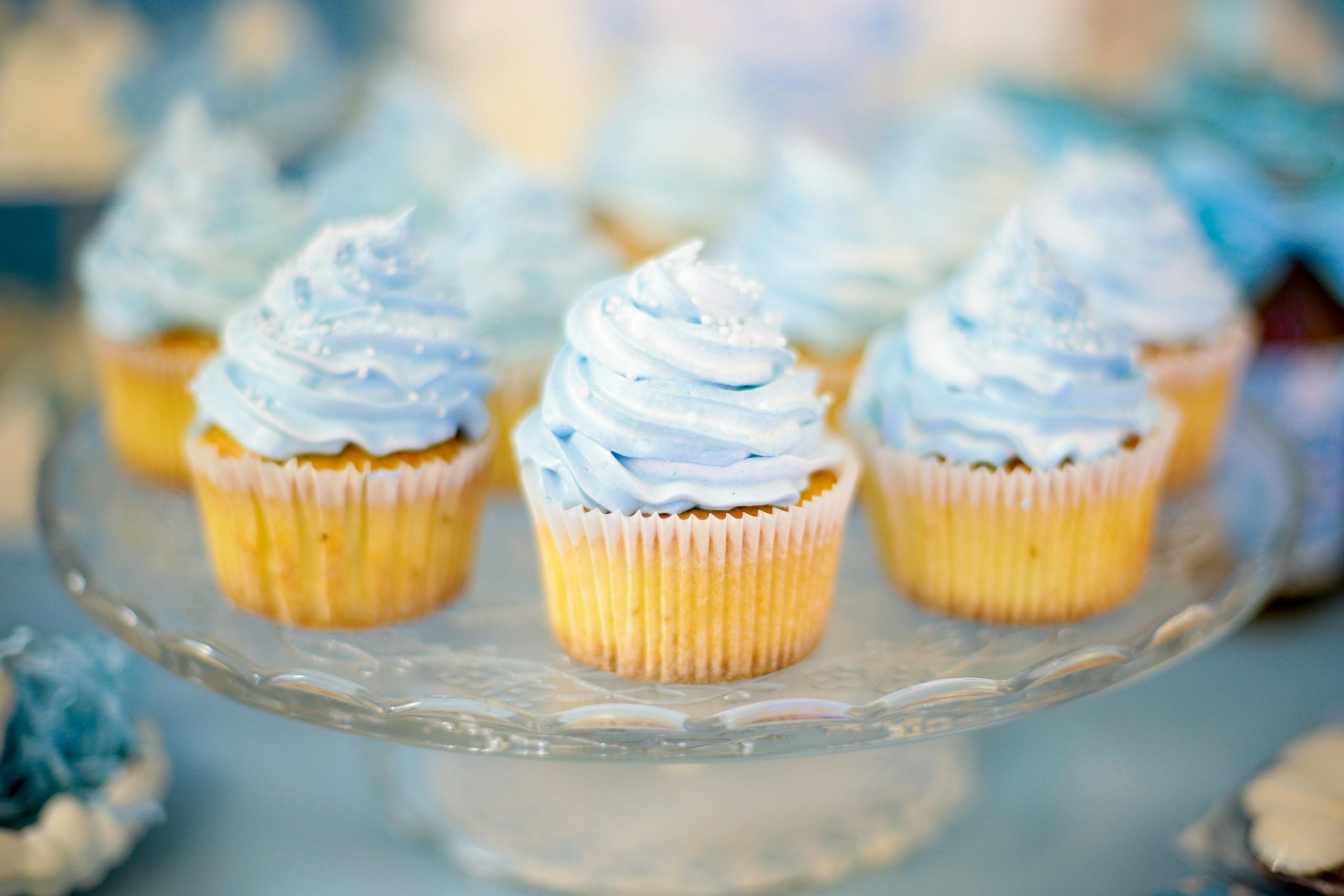 Close-up of mouthwatering cupcakes with blue icing, perfect for celebrations and parties.
